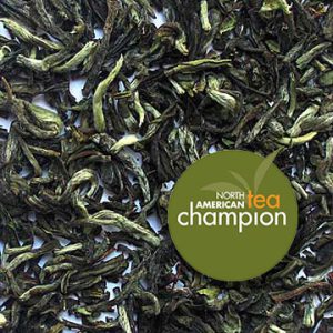 A sample of Darjeeling Glenburn Estate First Flush FTGFOP1 tea with award graphic "North American Tea Champion."