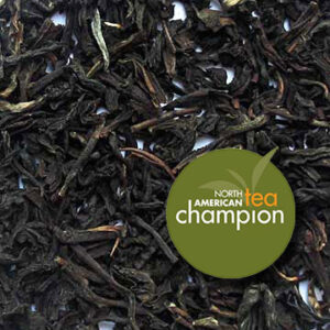 A sample of Glenburn Autumn Crescendo FTGFOP1 tea with award graphic "North American Tea Champion."