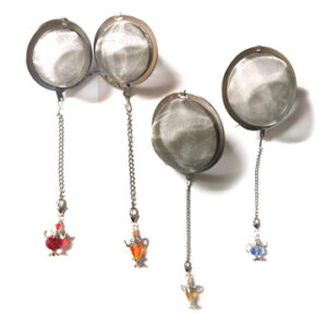 Four tea infuser balls with different colored charms.