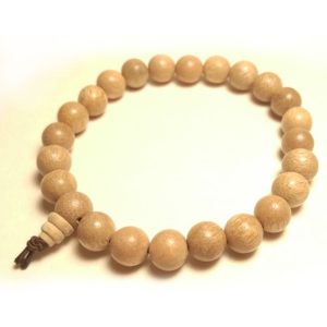 Wrist mala bracelet with camphor wood beads.